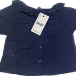 Back of newborn navy lace top with easy button closure