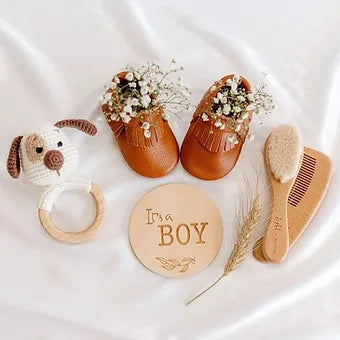 Side profile of breathable leather baby moccasins with frills