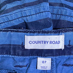 Close-up of elastic waistband on boys striped shorts