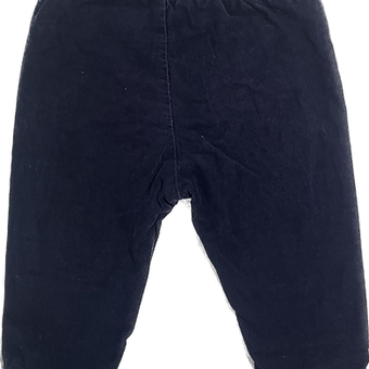 Flat lay of H&M navy cord pants showcasing slim fit and corduroy texture.