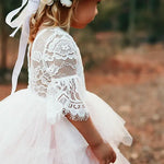 Girl wearing boho tutu dress as flower girl