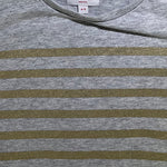 Close-up of fabric and stripe detail on girls Seed top