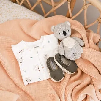 Baby romper with koala design showing reversible hand and foot cuffs