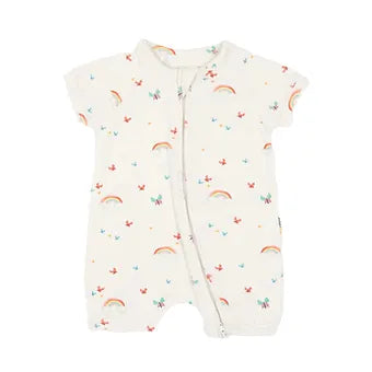 Matching baby romper and headband set laid flat, showcasing the colorful rainbow print.