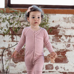 Close-up of 2-way zipper on organic cotton baby romper