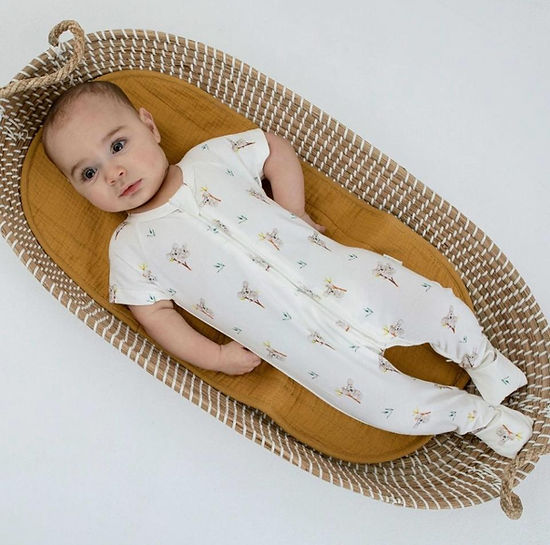 Front view of organic cotton baby romper with koala print