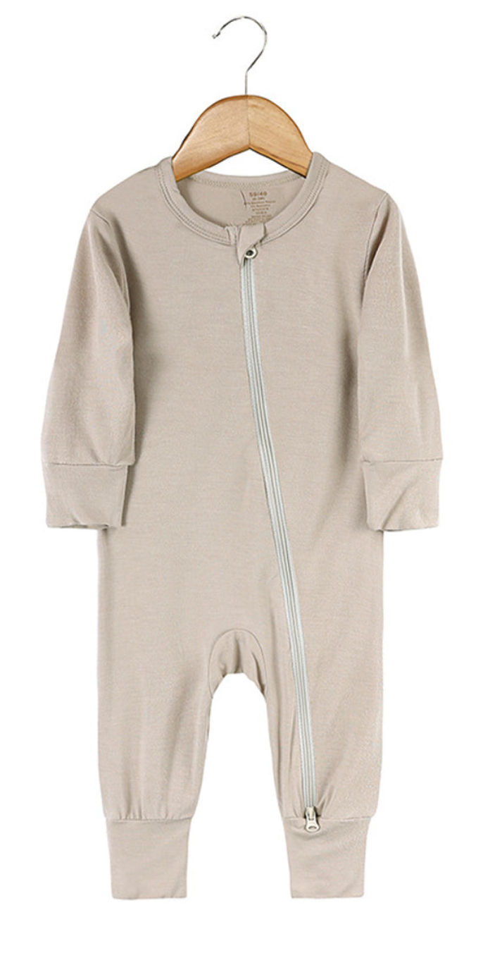 Beloved Bubs sleeveless bamboo romper in soft cloud pink, front view – baby jumpsuit made from breathable bamboo-spandex fabric.
