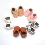 Front view of soft leather baby moccasins with frill design