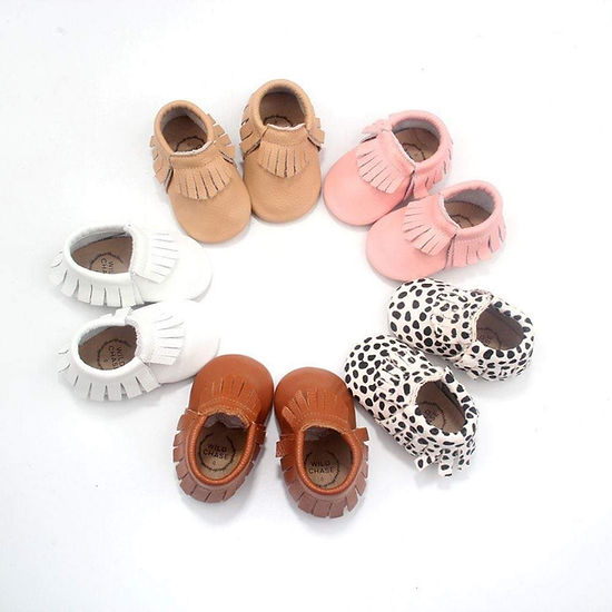 Front view of soft leather baby moccasins with frill design