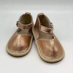 Close-up view of adjustable buckle strap on sandal