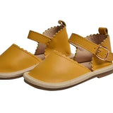 Gold leather sandals with heart-shaped cutouts top view