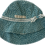 Teal polka-dot baby hat by Eternal Creation, featuring a wide brim and striped bow.