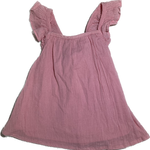 Front view of toddler girls blush cross-back top