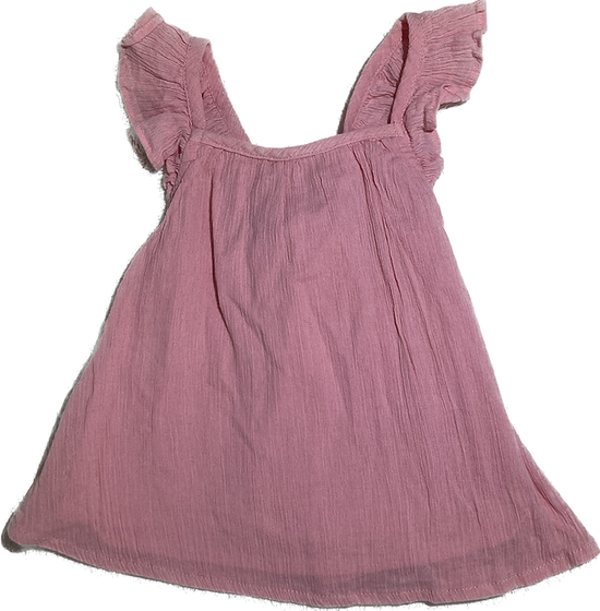 Front view of toddler girls blush cross-back top