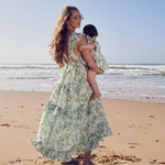 Back view of the Tropicana Floral Romper Dress, showcasing ruffle sleeve details and a stylish square neckline.