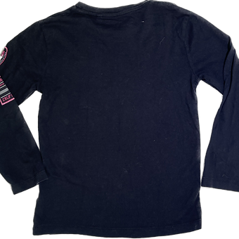 Back of women’s black skater top showing flared design