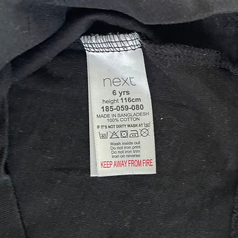 Flatlay of women’s black skater top, casual wear style