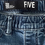 Back pocket detail of women’s blue stretch fit jeans
