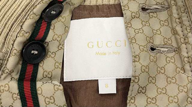 Front view of Gucci classic bomber jacket in GG monogram nylon.